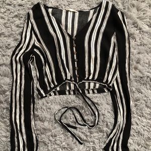 Black and white striped long sleeve crop top.